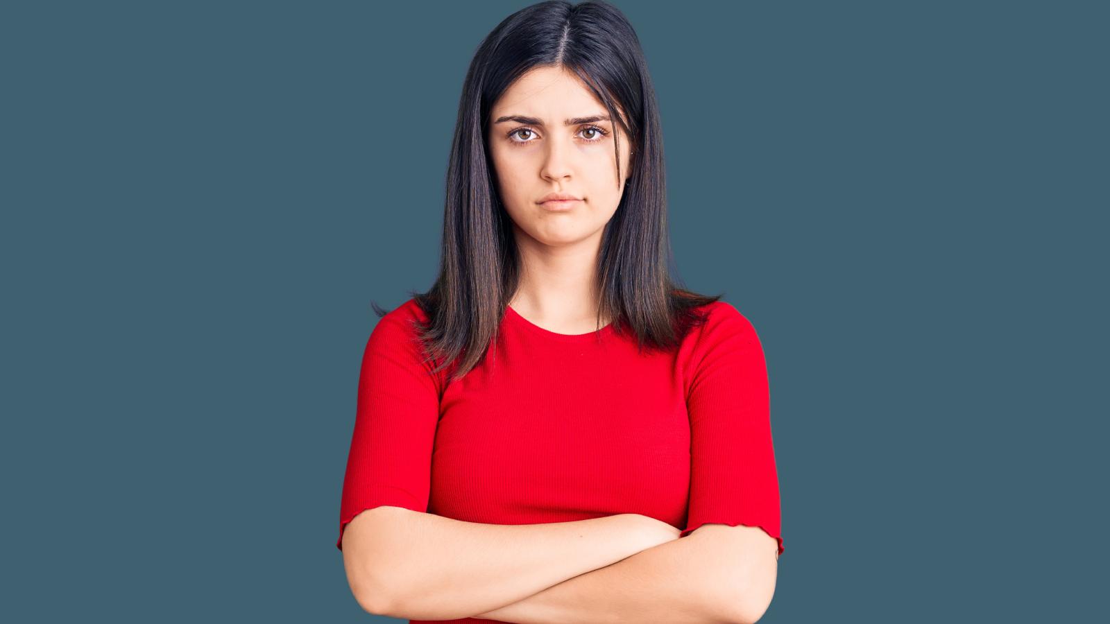 Her Boyfriend Caused Their Breakup Years Ago—So She Did the Same Thing to Him When He Got a New Girlfriend woman with her arms crossed