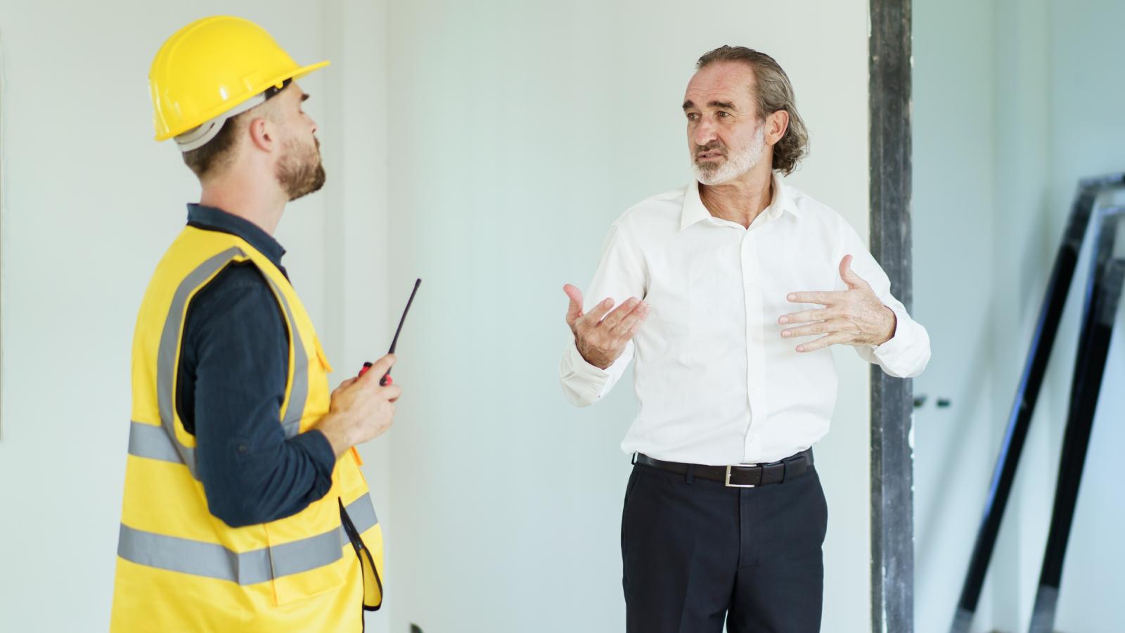 His Contractor Botched the House He Built for Him — So He Took Him to Court and Won Big man talking with a contractor