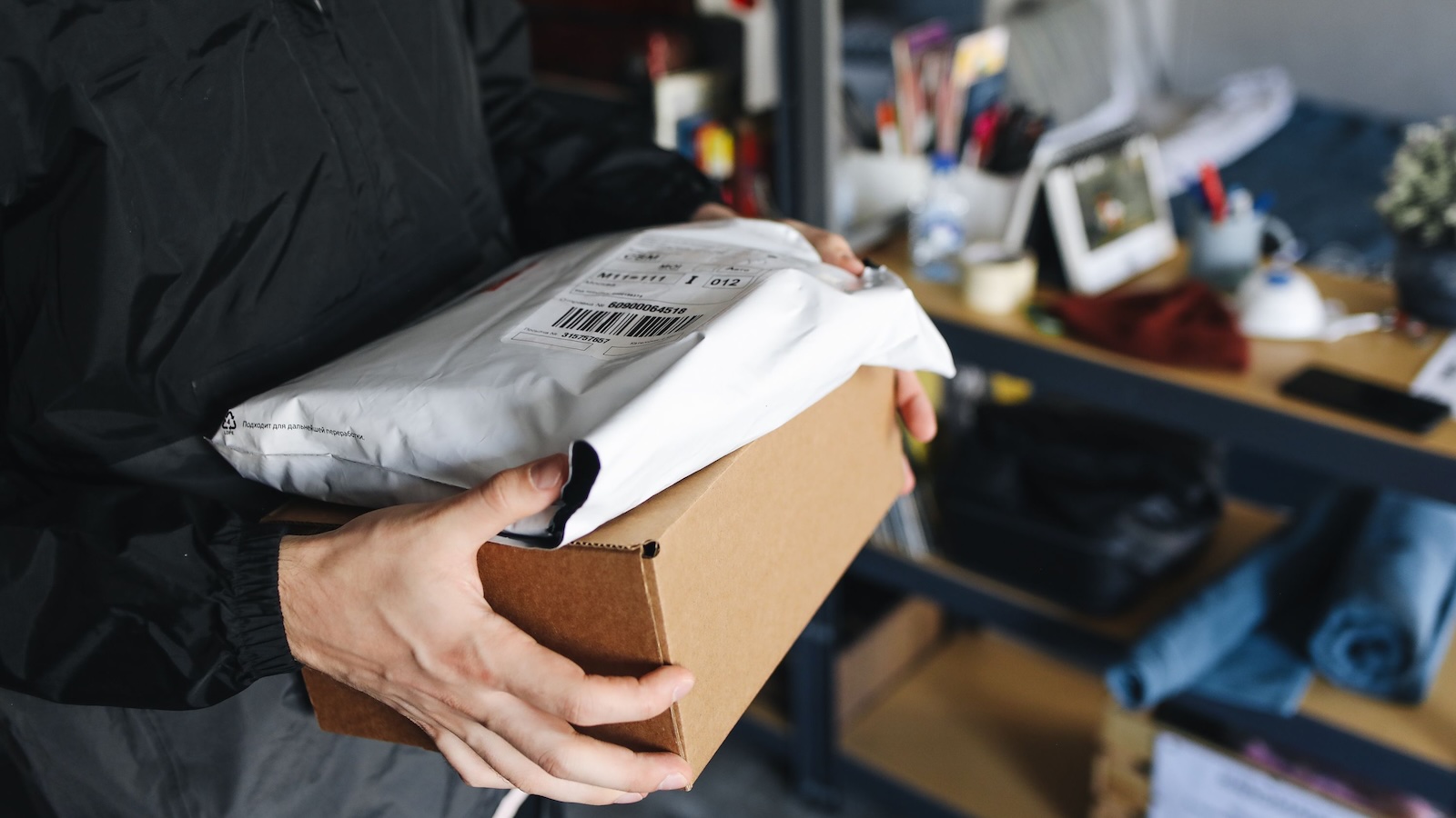 A Customer Showed Up Without ID For Her Package, Then Got Upset When The Store Followed Its Own Policy person holding two packages