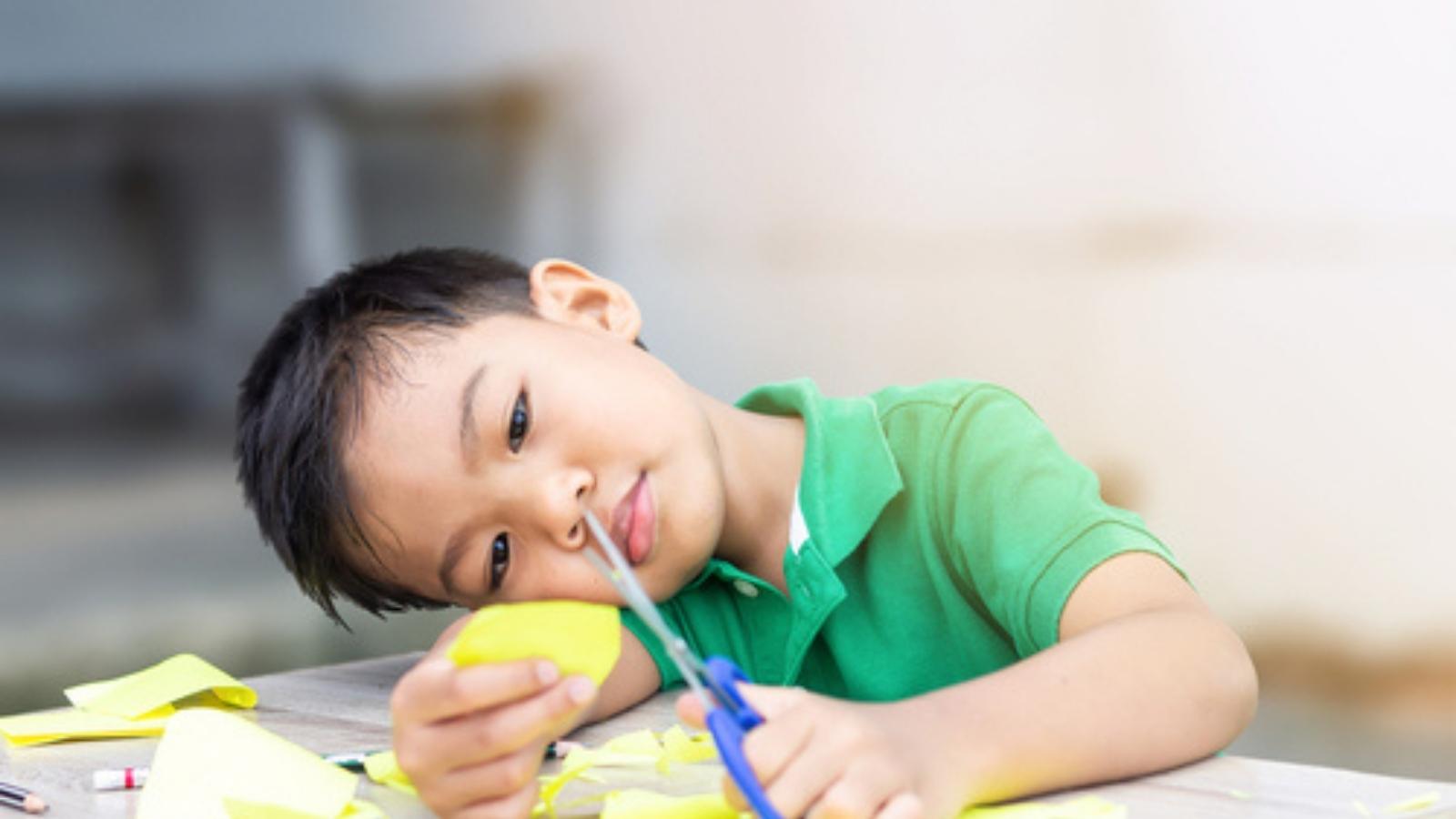 He Insisted He Was Observing Spatial Physics—Then Used Her Own Classroom Contract to Win Desk Playtime Kid cutting paper