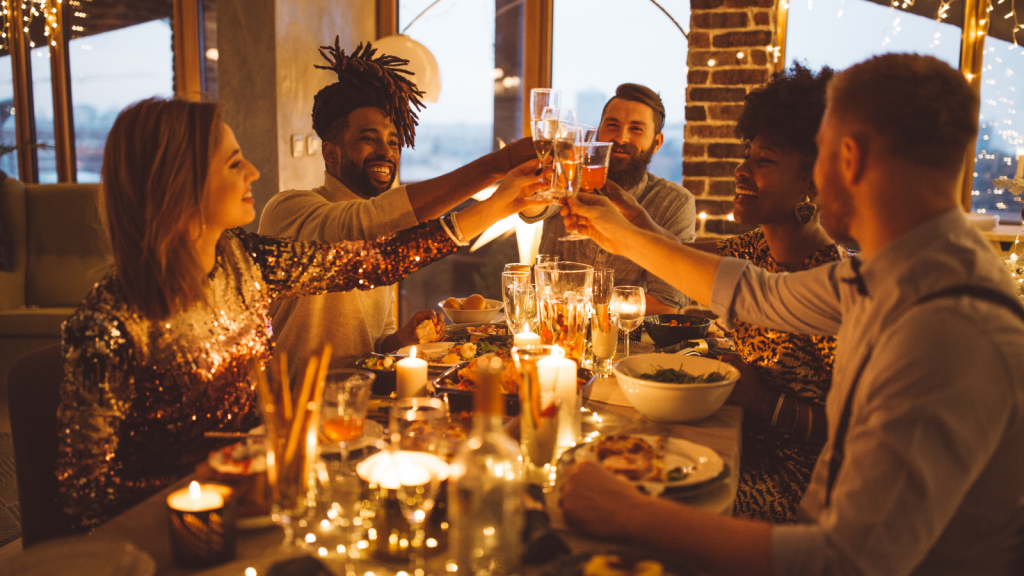She Wanted Her Child at an Adults Only Evening With Friends — Getting Told No Made Her Stop Talking to the Group Entirely people cheersing at a dinner