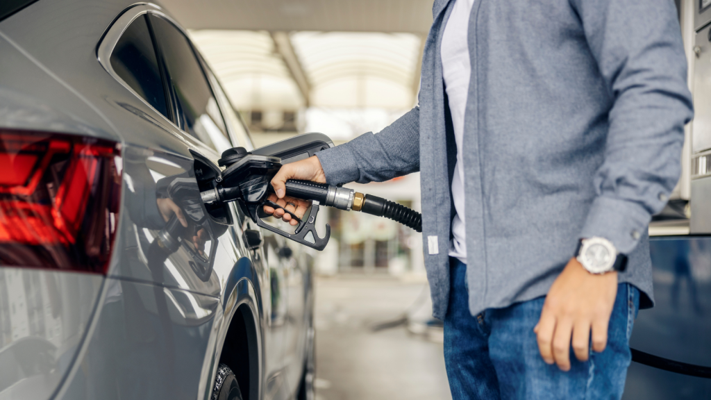 He Refused to Drive a Company Van with Exposed Steel Belts—Then Received a Formal Letter of Reprimand for Refusing Duty person filling car with gas at gas station