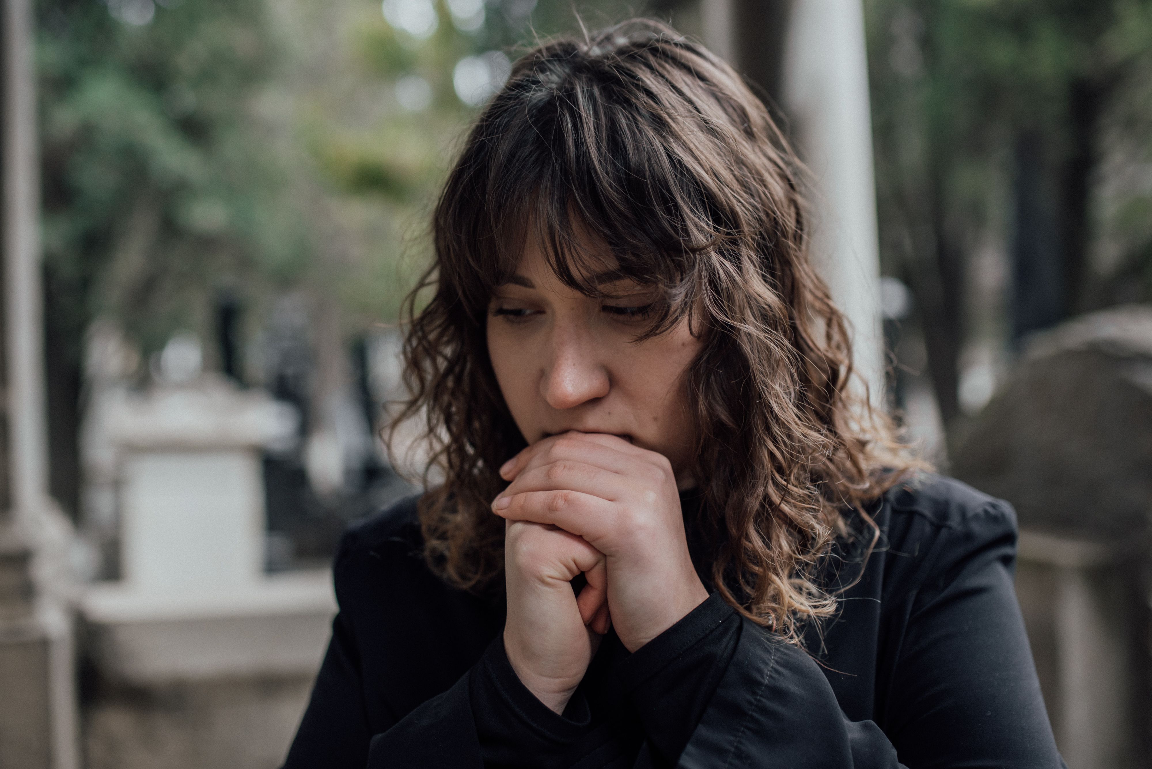 Sad woman in black outfit 
