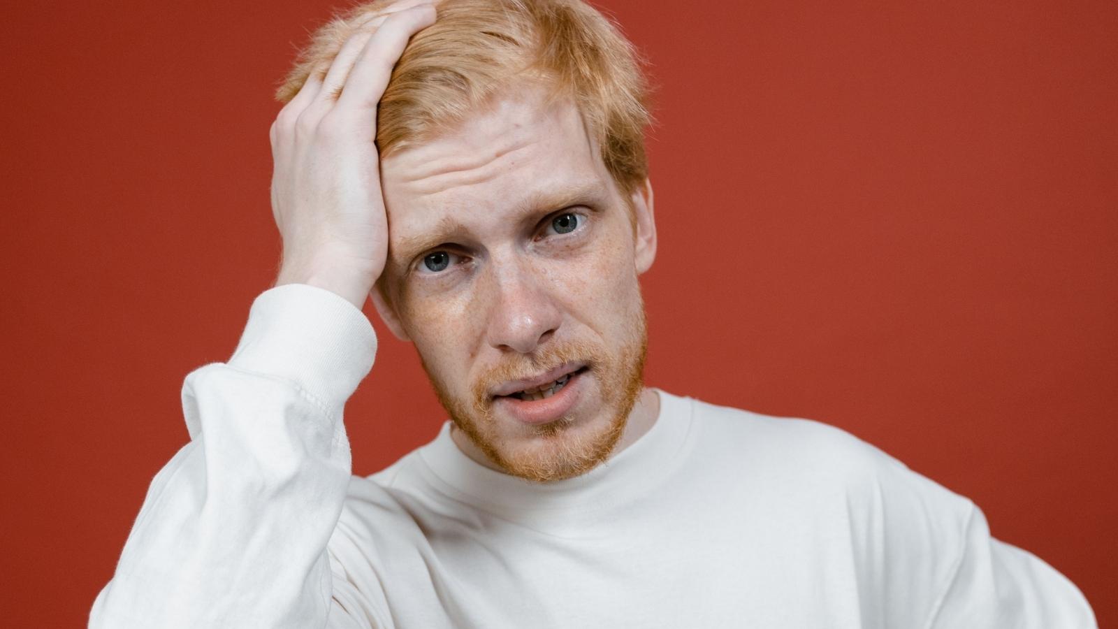 He Skipped a Business Contacts Deeply Personal Celebration of Life — Now Hes Wondering If That Was Rude redheaded man looking confused