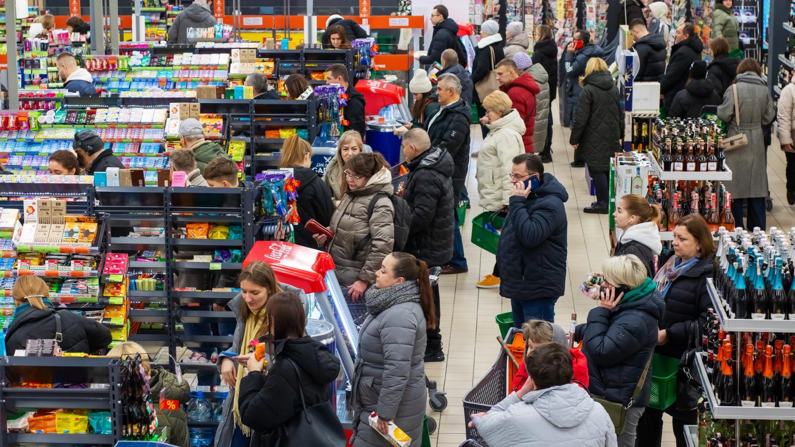 people in a crowded grocery store