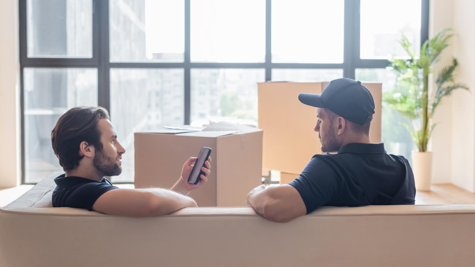 men talking in an apartment