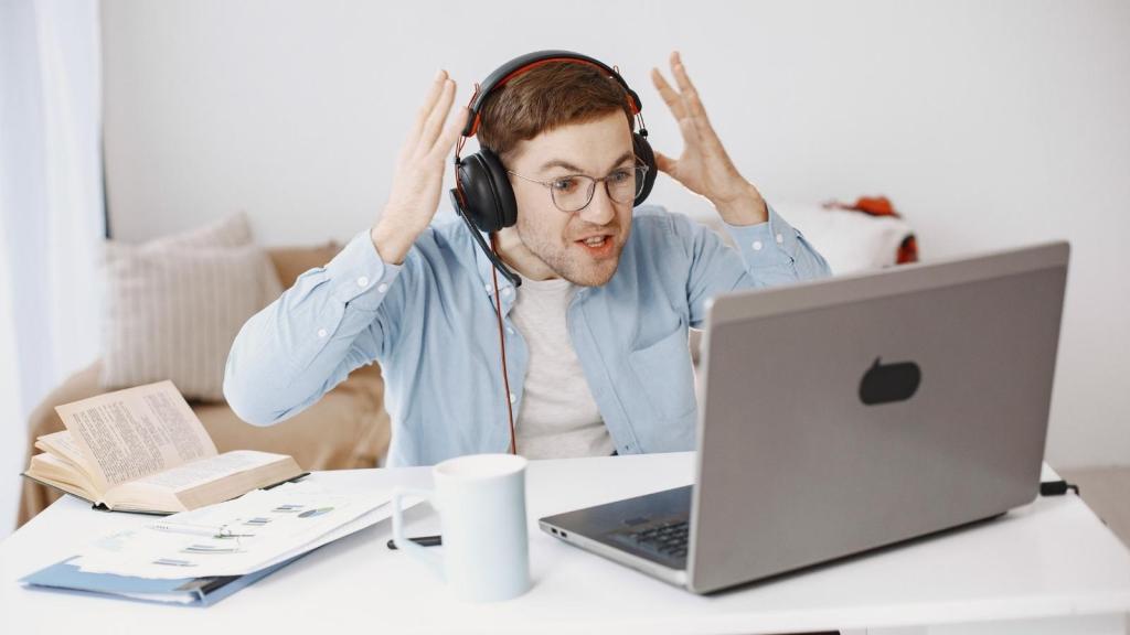 stressed employee yelling at his computer