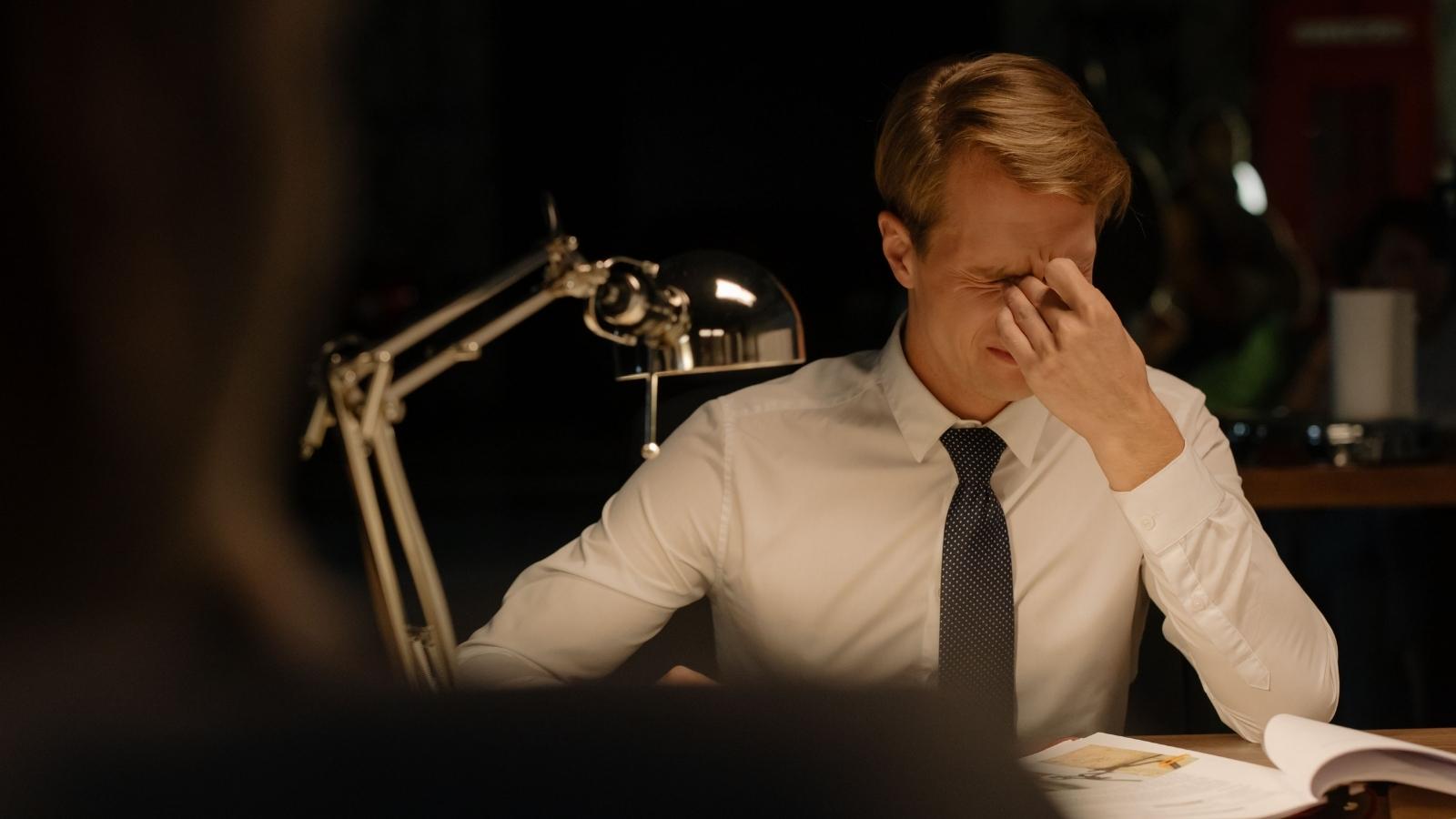 He Was Hired as a Growth Lead Based on Buzzwords—Then Handed a PIP with Metrics No One Could Define stressed professional man in his office