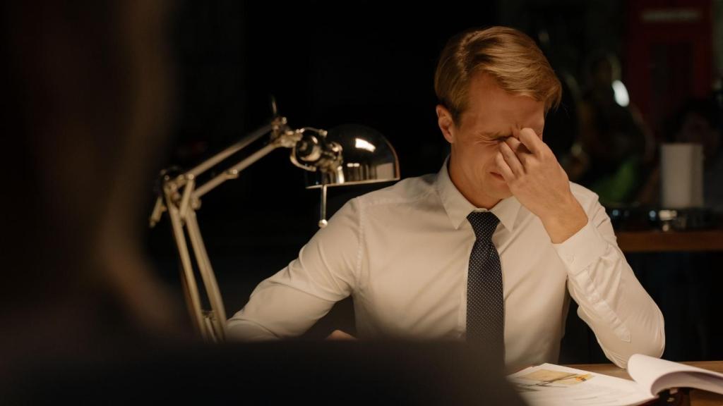 stressed professional man in his office