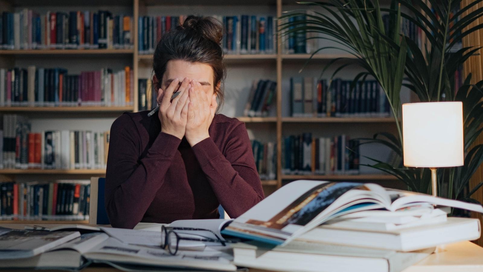 She Told Her Boss Her Exact Days Off, Over And Over — He Kept Scheduling Her On Those Same Days Anyway stressed woman putting hand over face