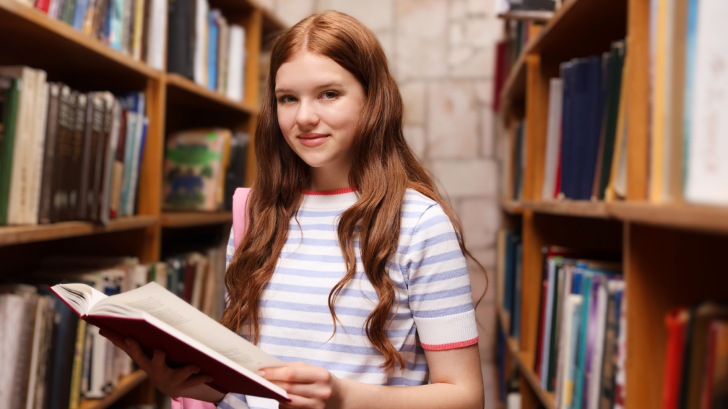 One Student Tried To Avoid Costly Overdue Fees By Secretly Putting The Books Back, Hoping The Library Would Never Notice student in a library