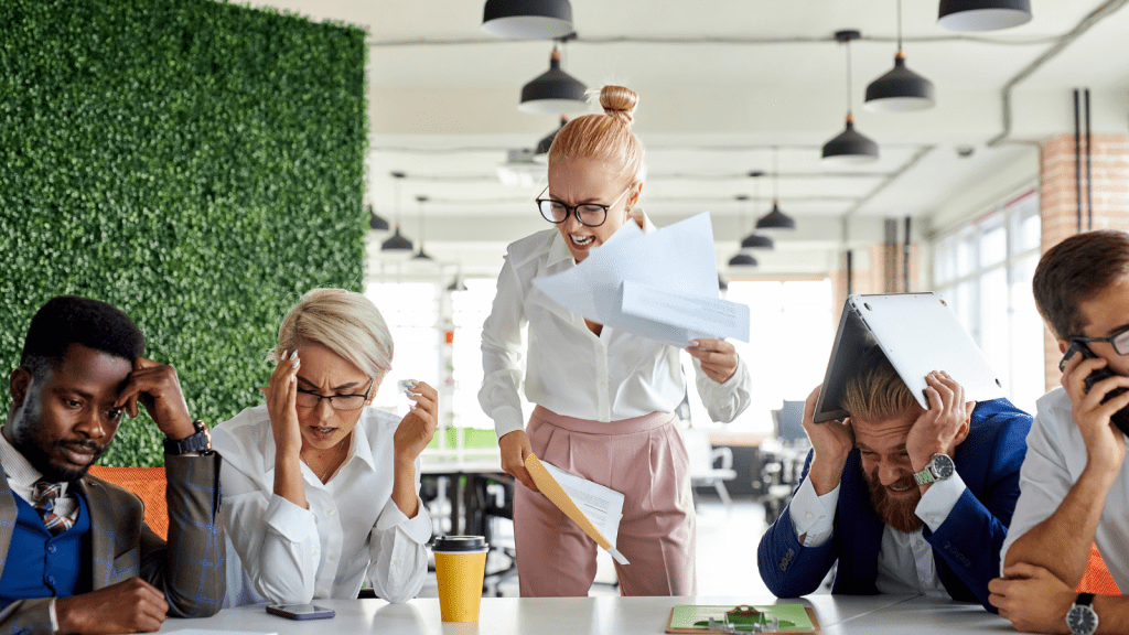 HR Said Bribes Are Never Allowed — An Employee Produced Evidence Saying Otherwise team of frustrated employees in a meeting