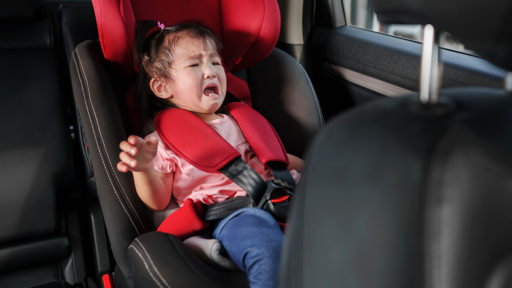toddler girl in the car crying