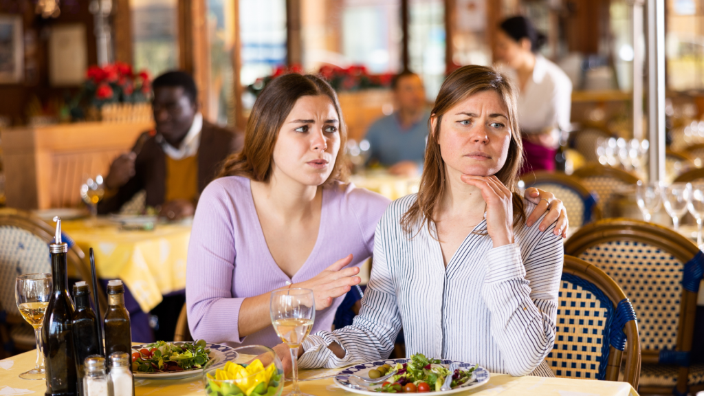 two sisters at dinner in contemplation