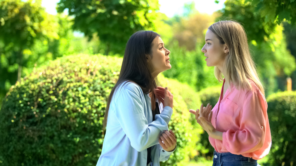She Respected The Bio Moms Request To Keep Her Kids Off Social Media — Posting Her Own Kids Still Sparked A Fight two women arguing outside