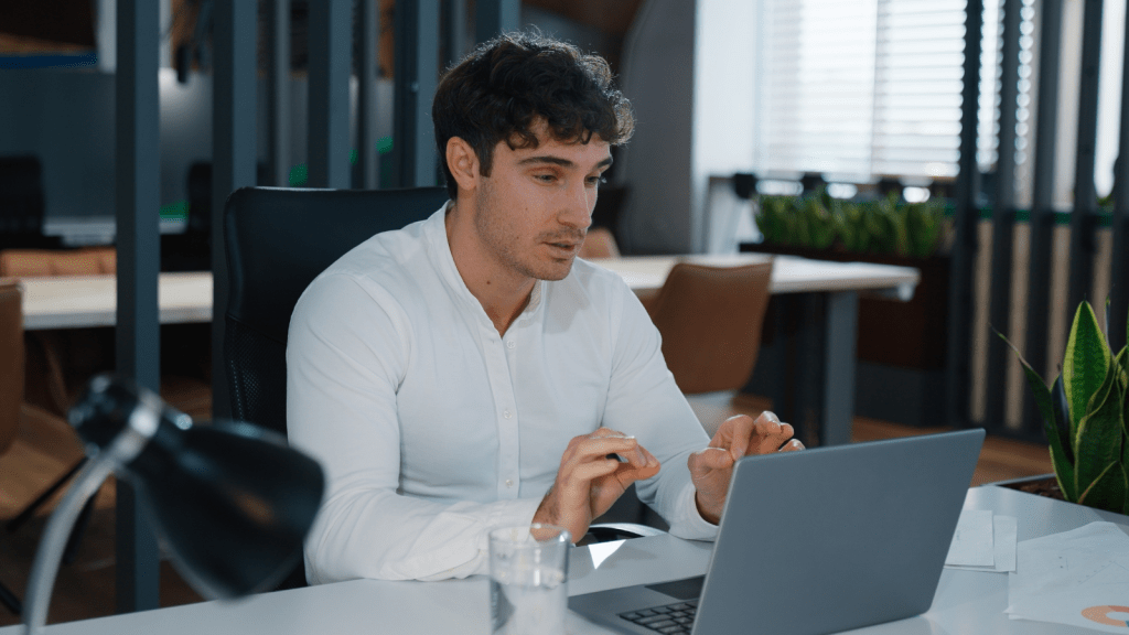upset businessman on computer perplexed