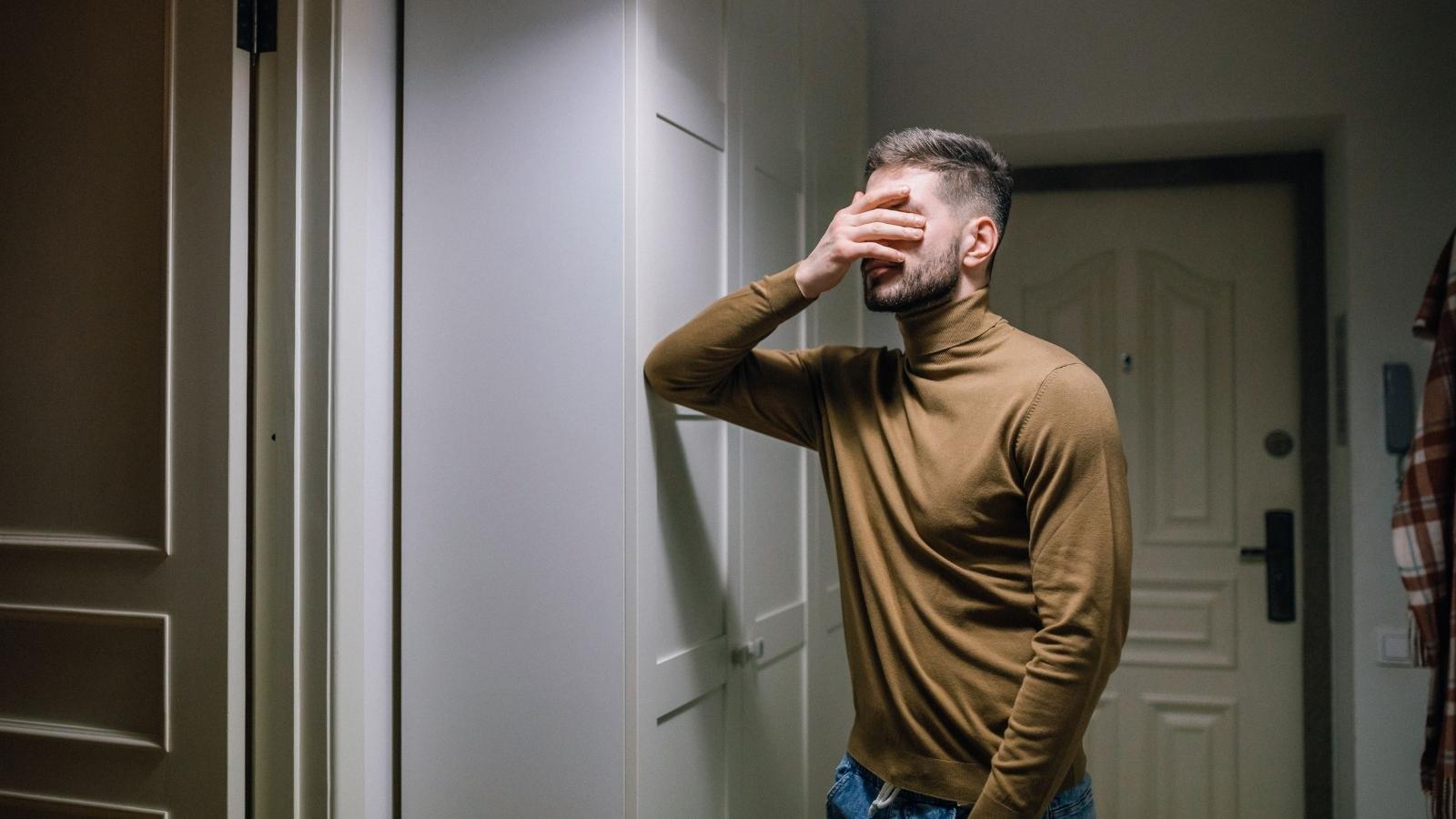He Keeps Hearing His Neighbors Accuse Him Of Something Every Night Through The Walls, And Hes Trying To Figure Out How To Respond Without Making It Worse upset man in his apartment