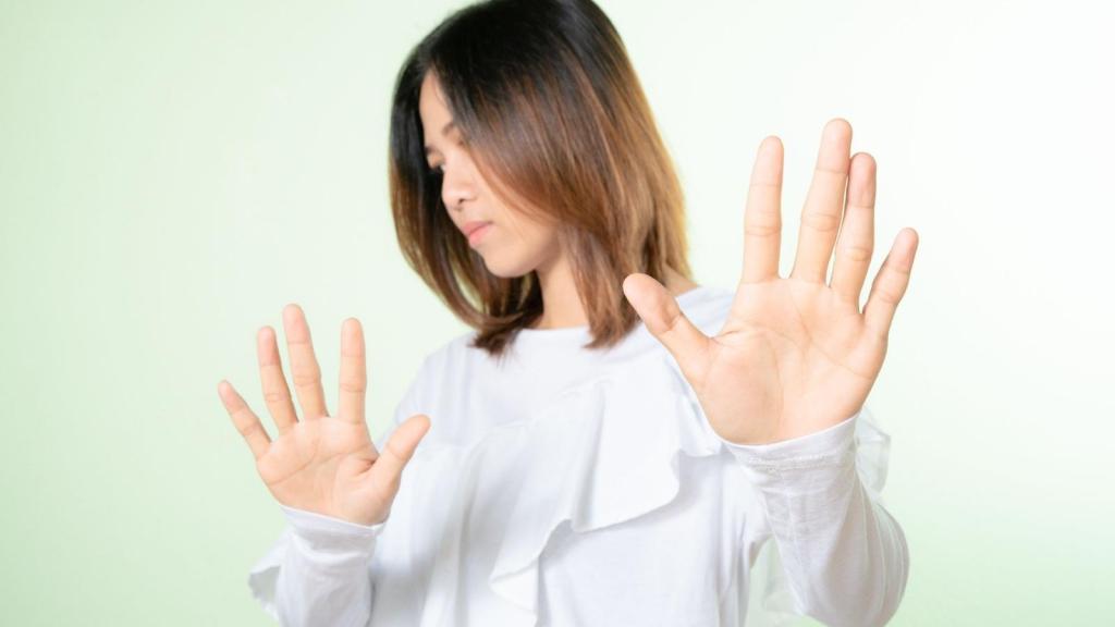 upset woman putting her hands in the air refusing