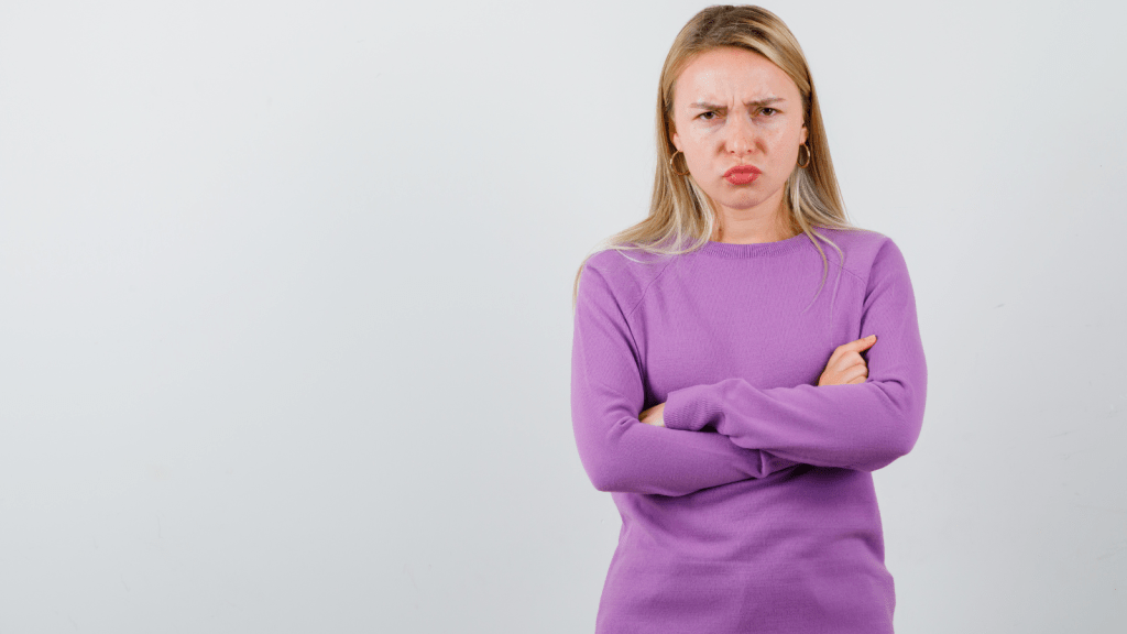 Woman Kept Pressuring Mutual Friends For Party Invitations, But Her Pushy Tactics Made The Entire Group Pull Away upset woman scowling