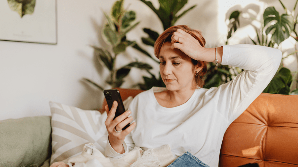 She Wants Boundaries With a Boss Who Never Stops Reaching Out — Her Mom Thinks She Should Just Keep Answering woman checking her phone