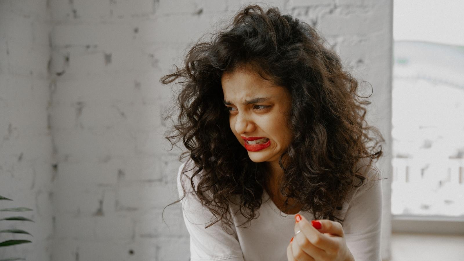 She Unfollowed Her Coworker After a Casual Interrogation About Her Partners Salary—Then Executed a Cold Professional Audit When Confronted woman grimacing
