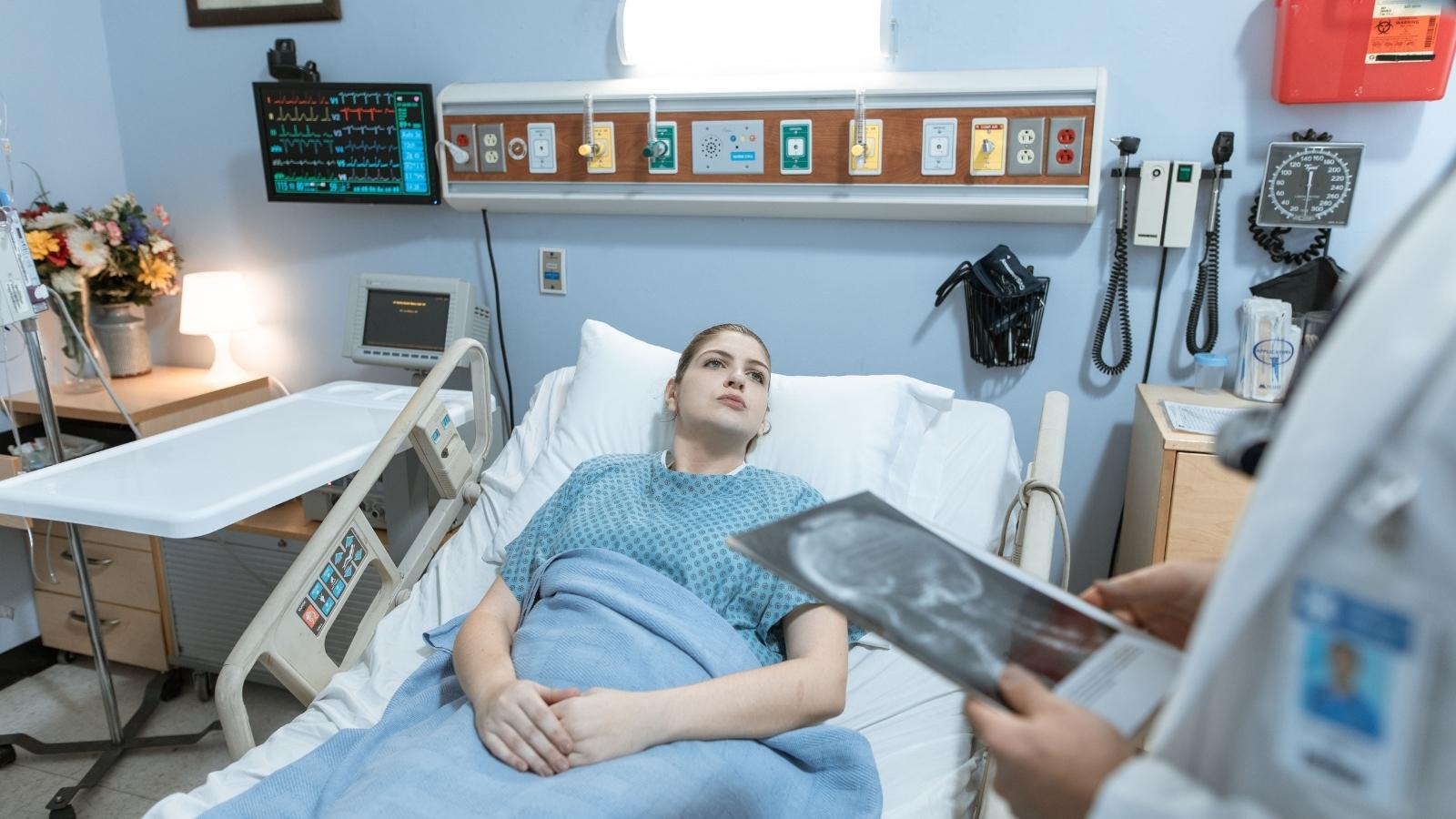 Management Demanded He Work Remote During Medical Recovery—Then Threatened to Cut His Annual Leave Balance in Half as Compensation woman laying in hospital bed