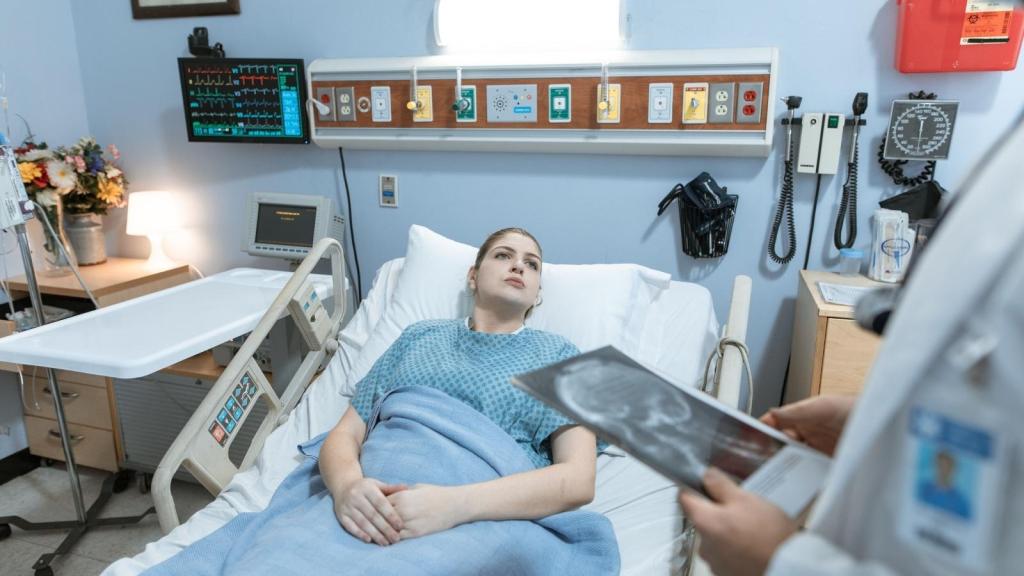 woman laying in hospital bed