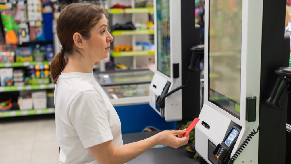 A Shopper Turned a Simple Milk Swap Into a Standoff — Pressuring a Worker to Leave Her Station Despite Repeated Nos woman paying with credit card at self checkout