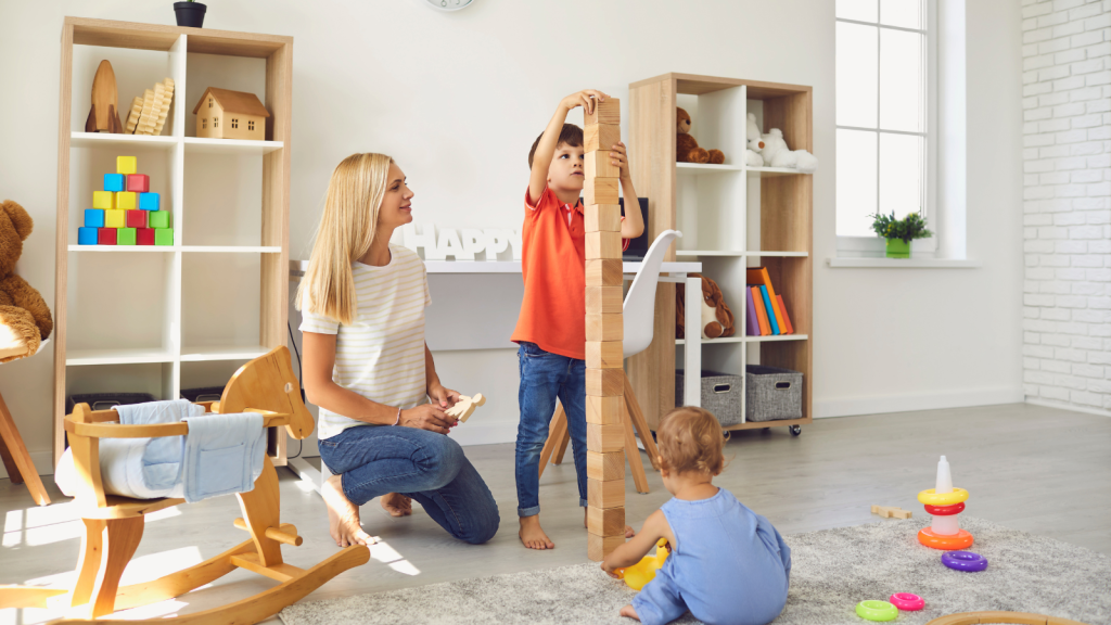 Shes Done Providing Free Childcare For Her Sister — But One Financial Change Could Make Paid Babysitting Work woman playing with two little boys