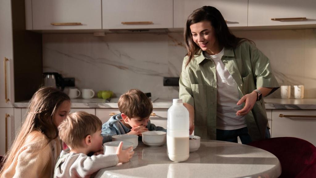 woman preparing breakfast for her kids