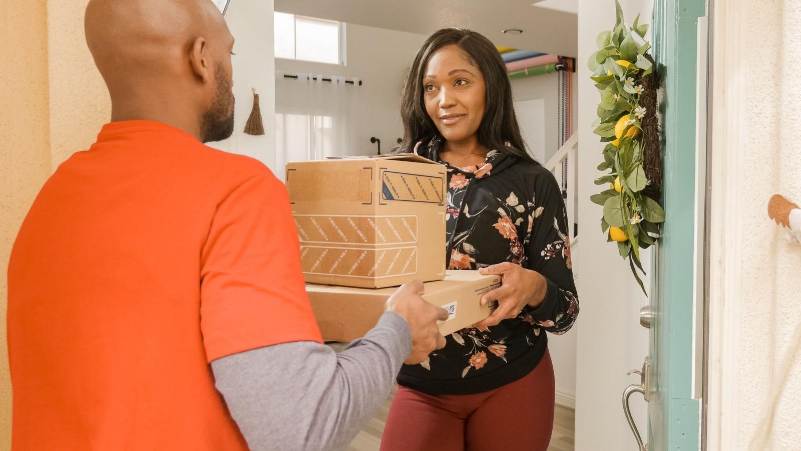 A Neighbor Claimed She Returned a Misdelivered Package—Then Ghosted Her Next Door Buyer for Weeks When It Never Showed Up woman receiving a package delivery
