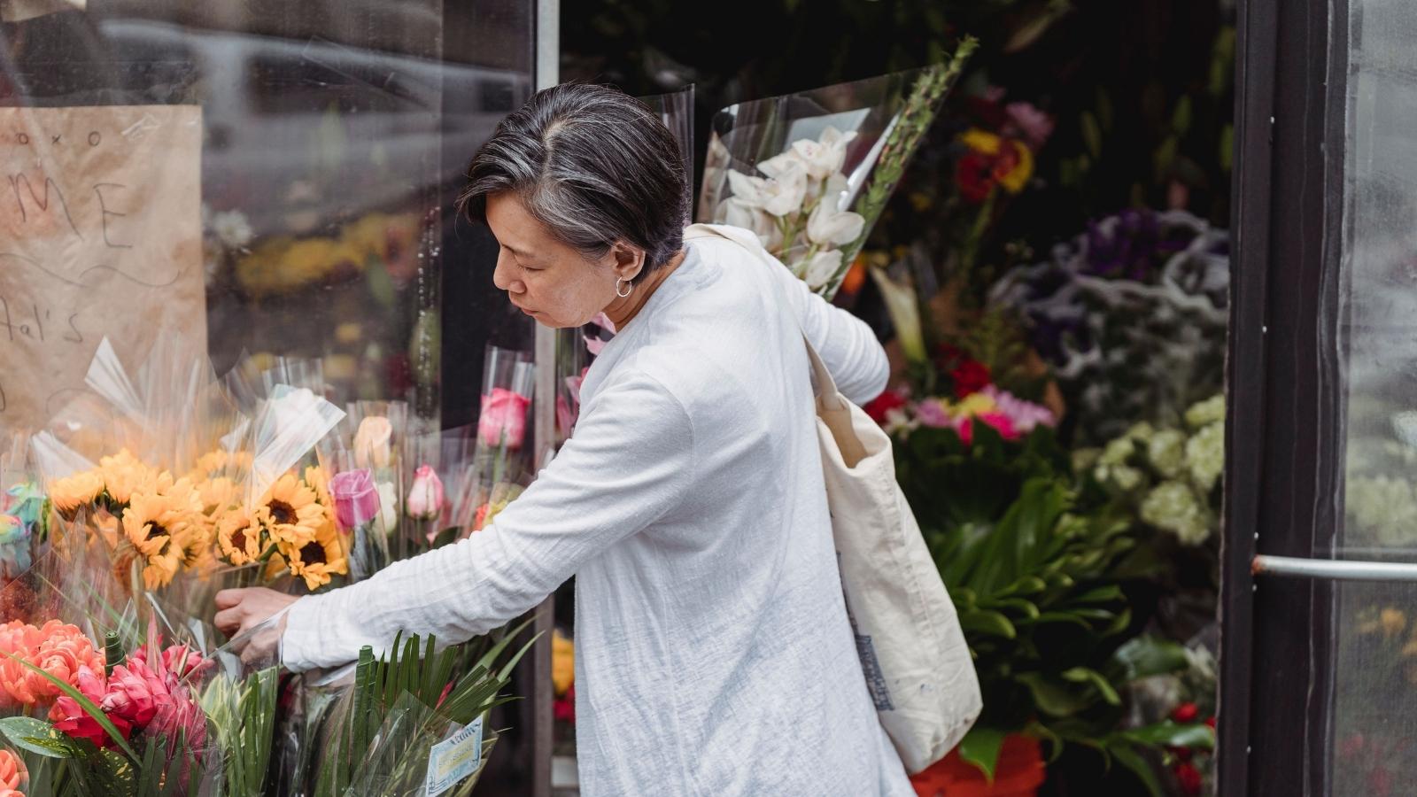 woman shopping for flowers