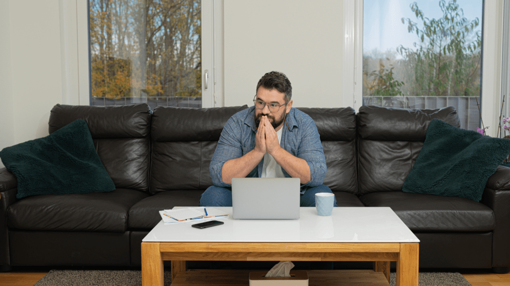 One Man Reached His Limit After His Mom Helped His Sister Take His Stuff, So He Made It Clear She Was No Longer Welcome worried young man deep in thought