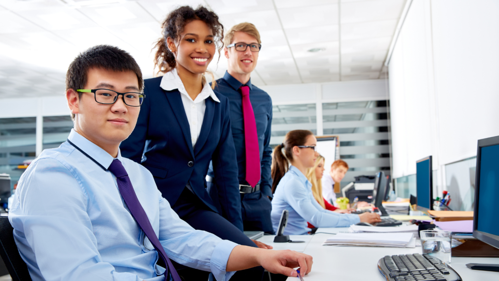 A Shift in Mileage Reimbursements Made Remote Work Too Expensive—Now Employees Are Flocking Back to Their Desks young business team employees working in an office