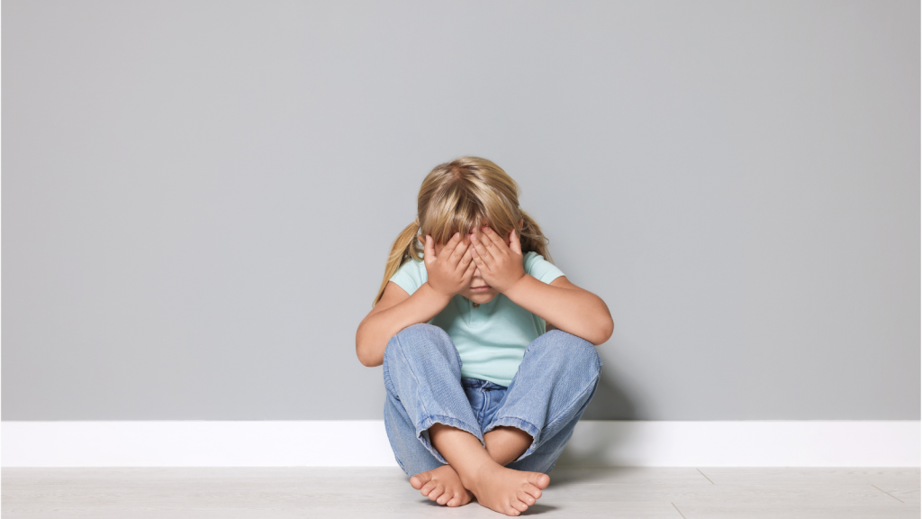 Woman Learns Her Sister Plans To Foster A Child, But She Says There’s A Troubling Motive Behind The Decision That Others Don’t Know About young girl sitting covering her eyes
