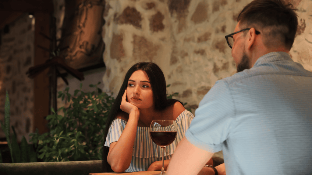 young man at dinner with girlfriend