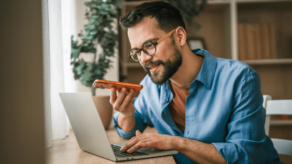Rude Manager Forced An Employee To Put Company Expenses On His Personal Credit Card, But Years Later It Paid Off Big young man in glasses working on computer while talking on cell phone