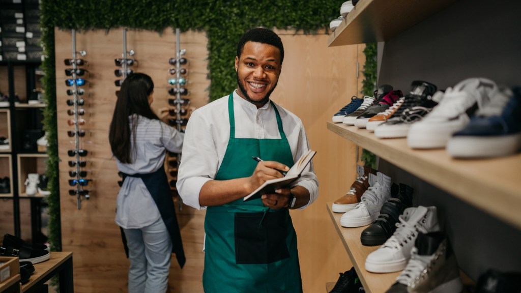 Man Stopped Checking With His Boss During Customer Transactions, But The New Rule Created Longer Lines And More Underpriced Sales young man retail associate smiling