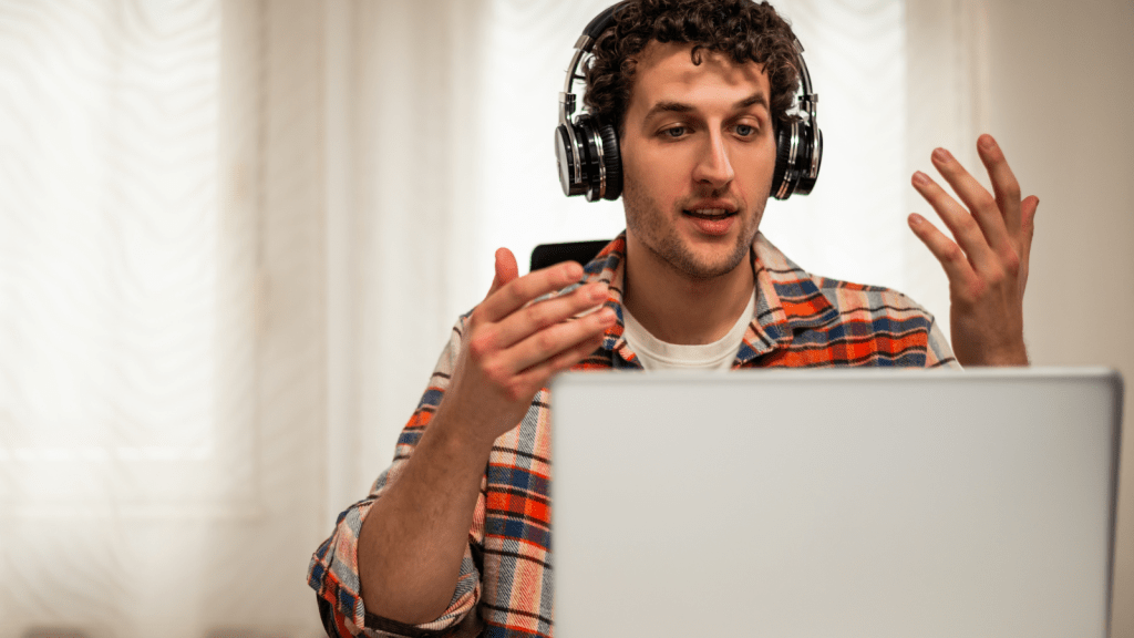 young man working from home on laptop in meeting