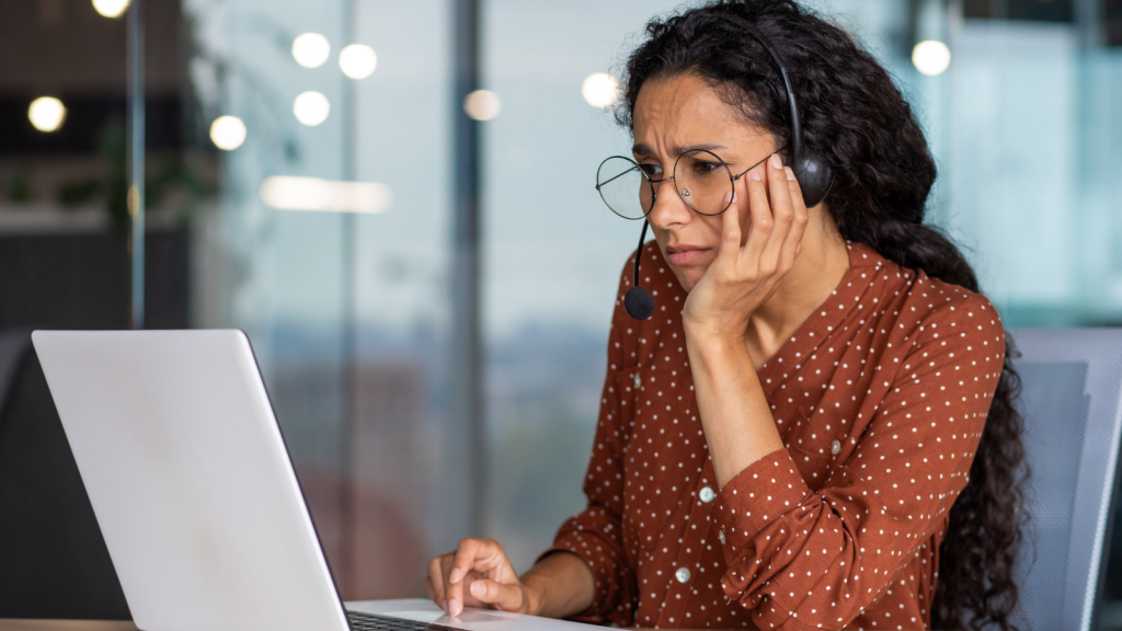 One Customer Turned A Helpful Call From The Bank Into A Heated Confrontation, Telling The Representative She Never Wanted To Be Contacted Again young woman on headset phone call at the office