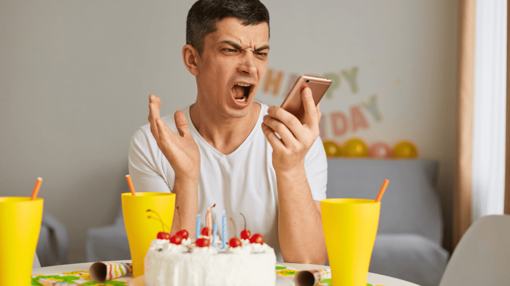 An angry man with birthday decorations