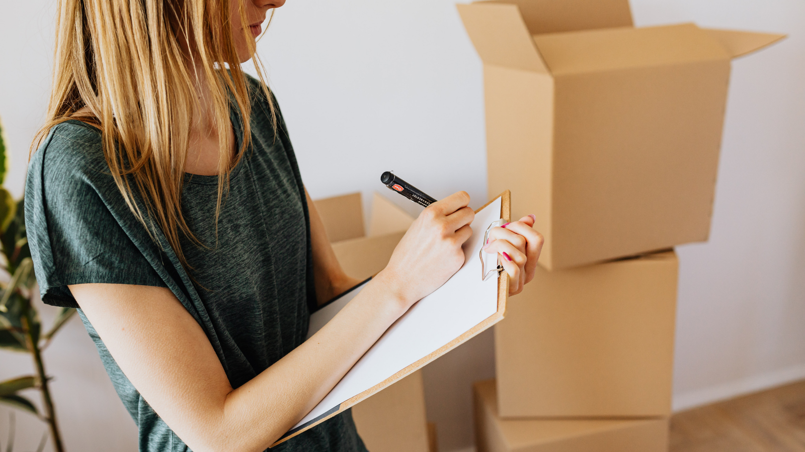 She Catfished Her Roommate After a Broken Lease—Then Got Unmasked by an IP Telemetry Dossier and Police Harassment Report A woman packing moving boxes