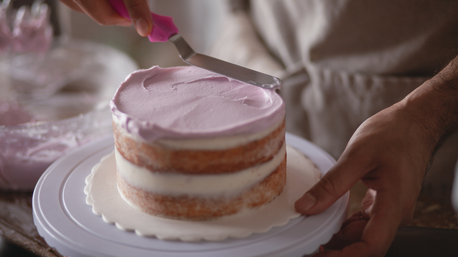 She Usually Has To Rush Through Basic Cake Orders At The Grocery Store, But Then A Guy Walked In With An Incredibly Specific Request A person decorating a cake