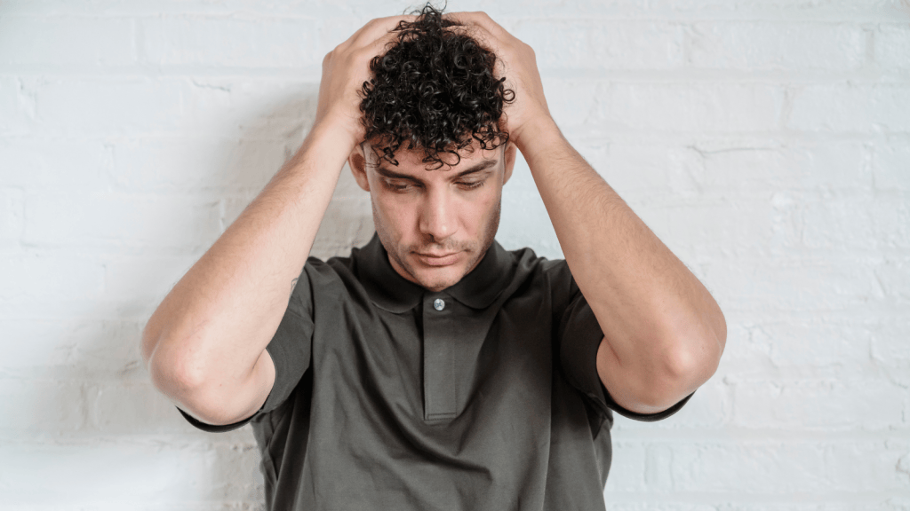 A man with his head in his hands