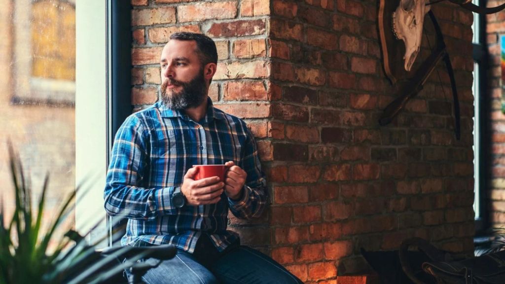 Man sitting on windowsill