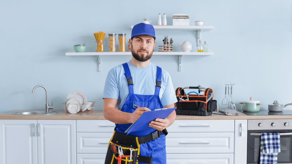 One Property Owner Thought Sending Help Was Enough, But His Renters Felt Neglected Because He Rarely Showed Up In Person Plumber working in a kitchen