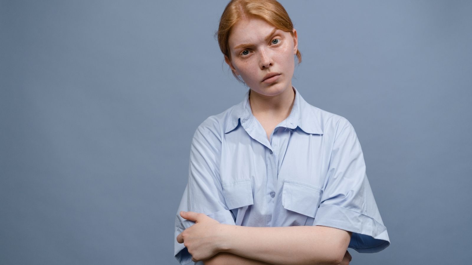 Woman cocking her head with a disapproving look