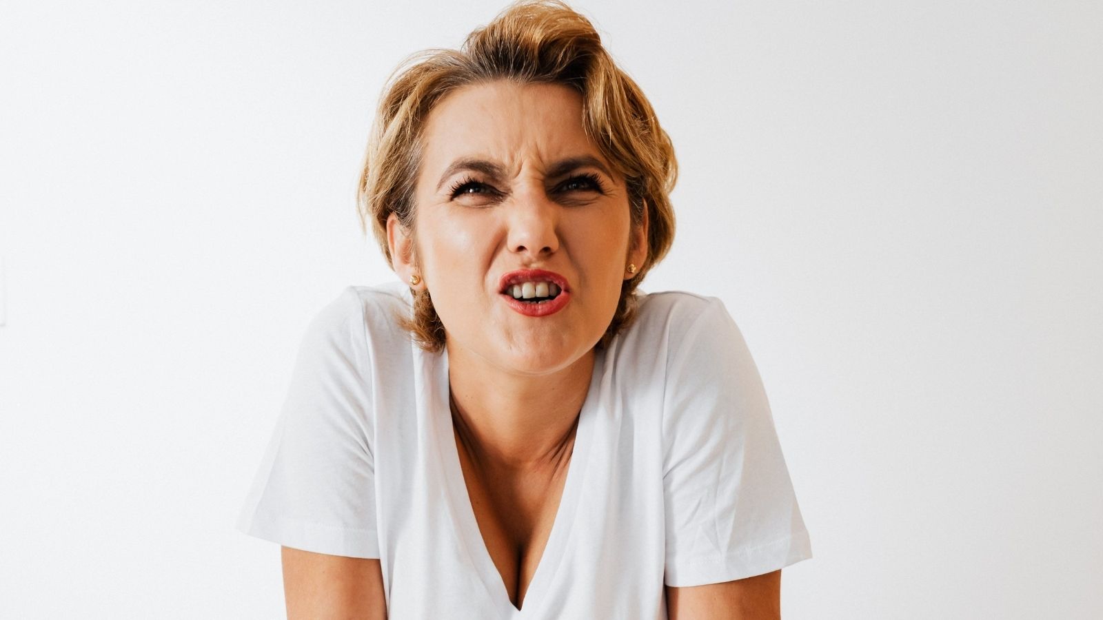 Middle-aged woman yelling at a teen