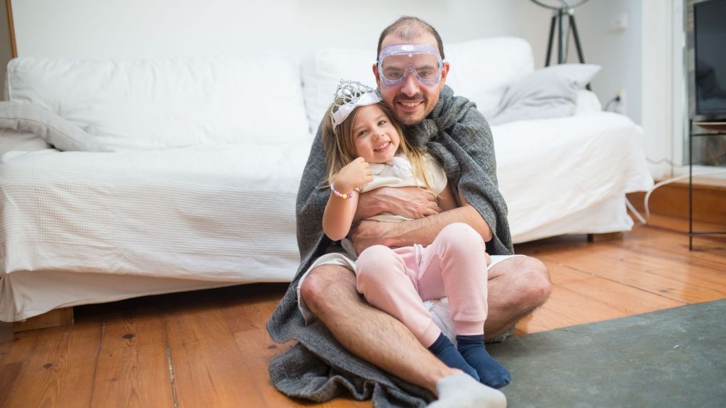 Man hugging his 4 year old daughter