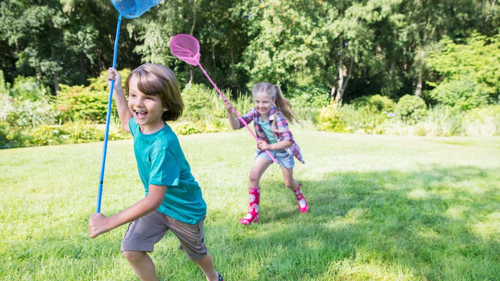 happy boy and girl playing outside